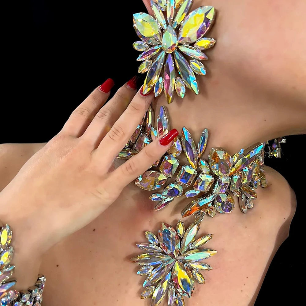 StoneFans rhinestone flower jewelry set for women featuring a glamorous necklace, earrings, and bracelet with sparkling stones.