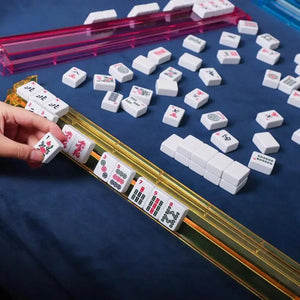 Set of four multicolor acrylic Mahjong tile pushers for family board games, ideal for storage and game organization.