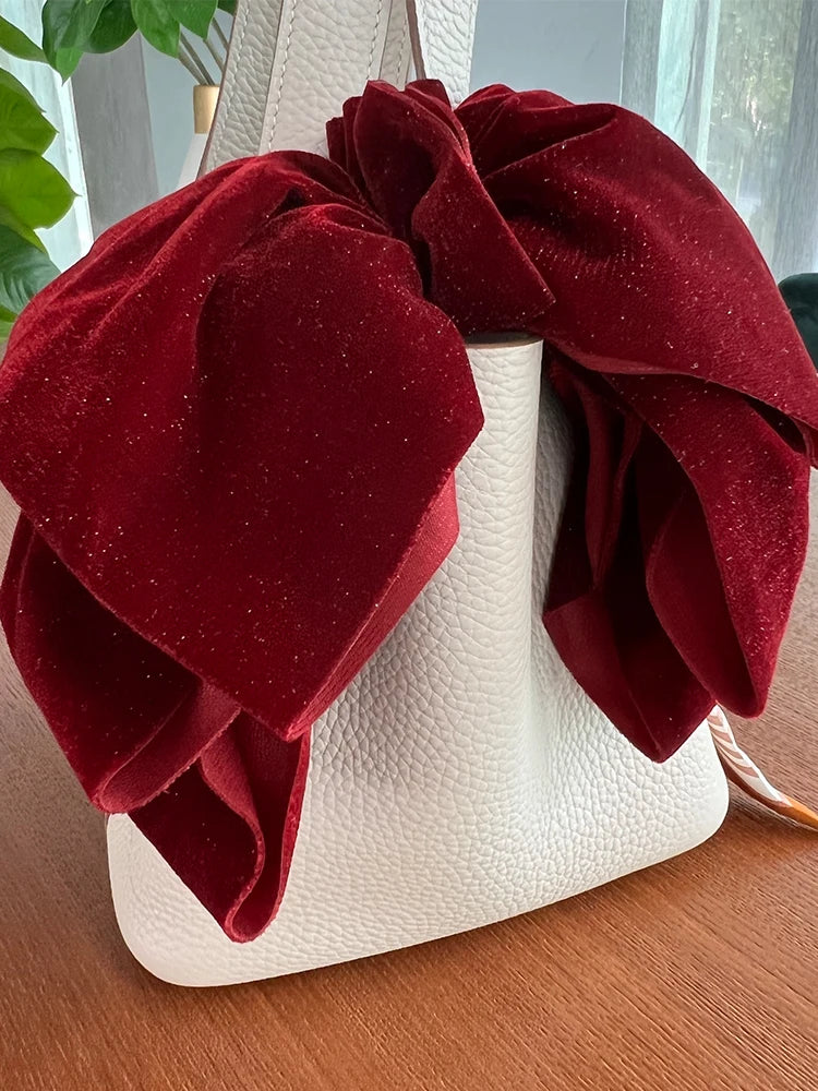 Velvet oversize bow hair clip for women and girls, stylish accessory from Hot Trend Vault, featuring a soft, plush fabric design.