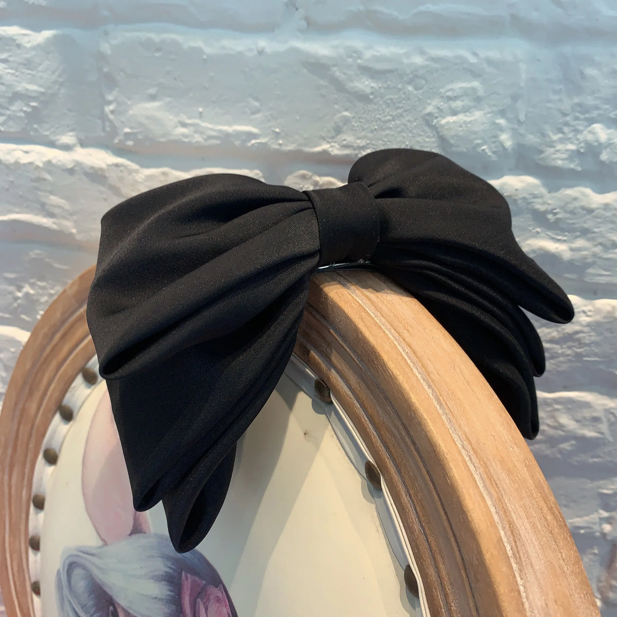 Multi-layer pink and black fashion hair clips for women and girls by Hot Trend Vault, shown in a close-up image.