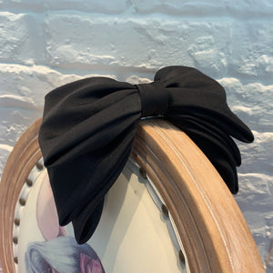 Multi-layer pink and black fashion hair clips for women and girls by Hot Trend Vault, shown in a close-up image.