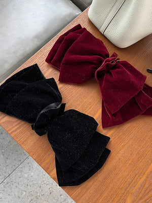 Velvet oversized bow hair clip for women and girls, stylish accessory by Hot Trend Vault, featuring a soft, elegant design.