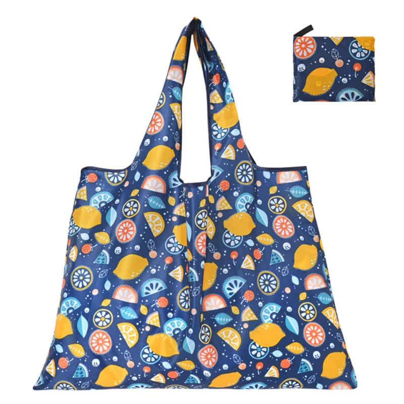 Hot Trend Vault Clyine reusable folding shopping bag with cartoon lemon and strawberry print, eco-friendly portable tote for shoppers.