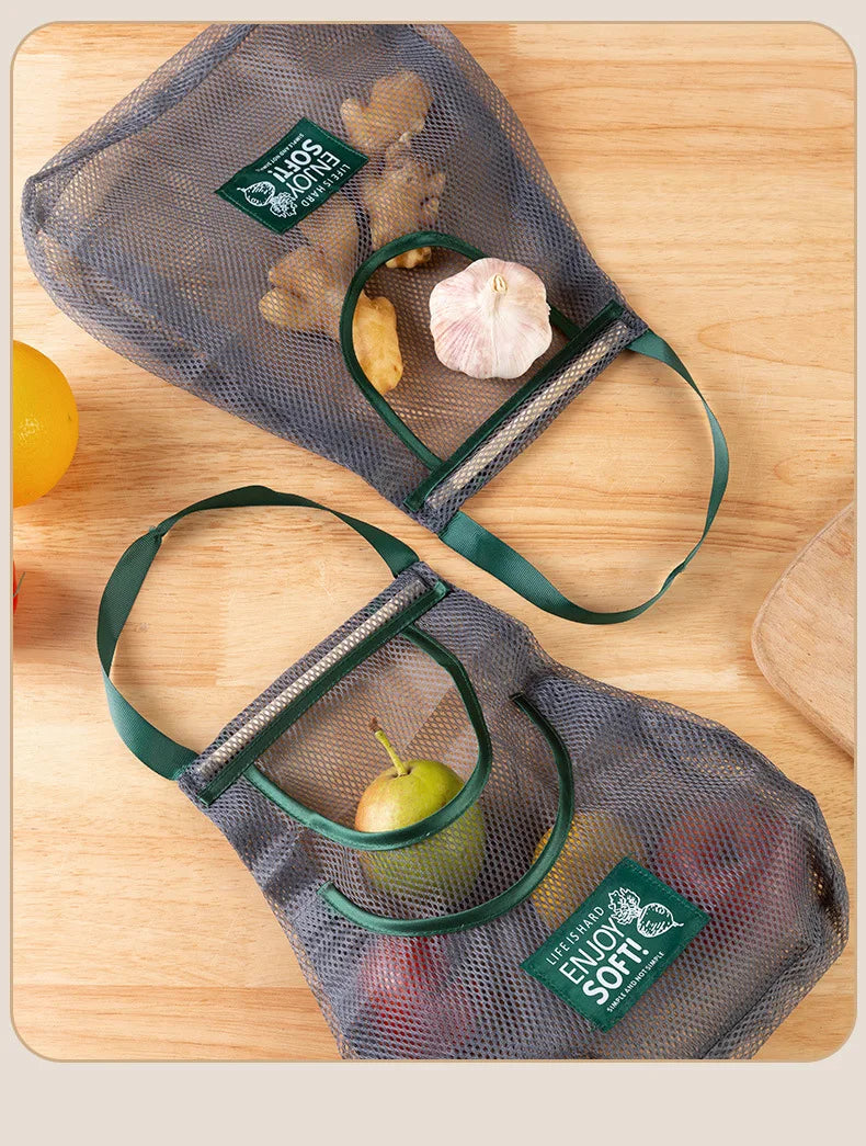 Reusable mesh storage bags hanging in a kitchen for vegetables, designed by Hot Trend Vault for eco-friendly home organization.