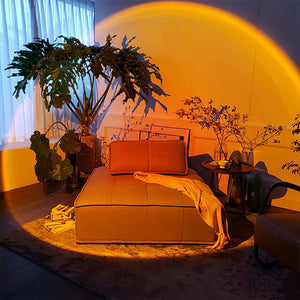 Hot Trend Vault Sunset Lamp Projector displaying colorful rainbow night light for romantic ambiance on a surface.