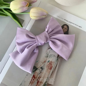Oversized satin bow knot hair clip for women, elegant accessory with a barrette style, by Hot Trend Vault.