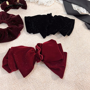 Velvet oversized bow hair clip for women and girls, stylish accessory by Hot Trend Vault, featuring a soft, elegant design.