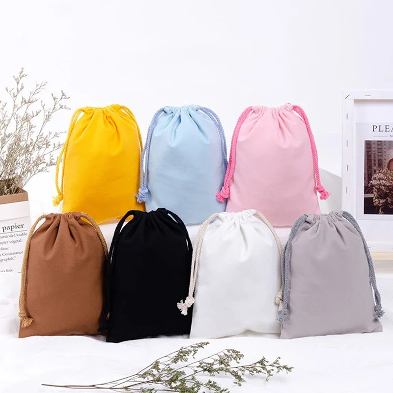 Reusable cotton produce bags with drawstrings by Hot Trend Vault, eco-friendly kitchen storage for fruits and vegetables.