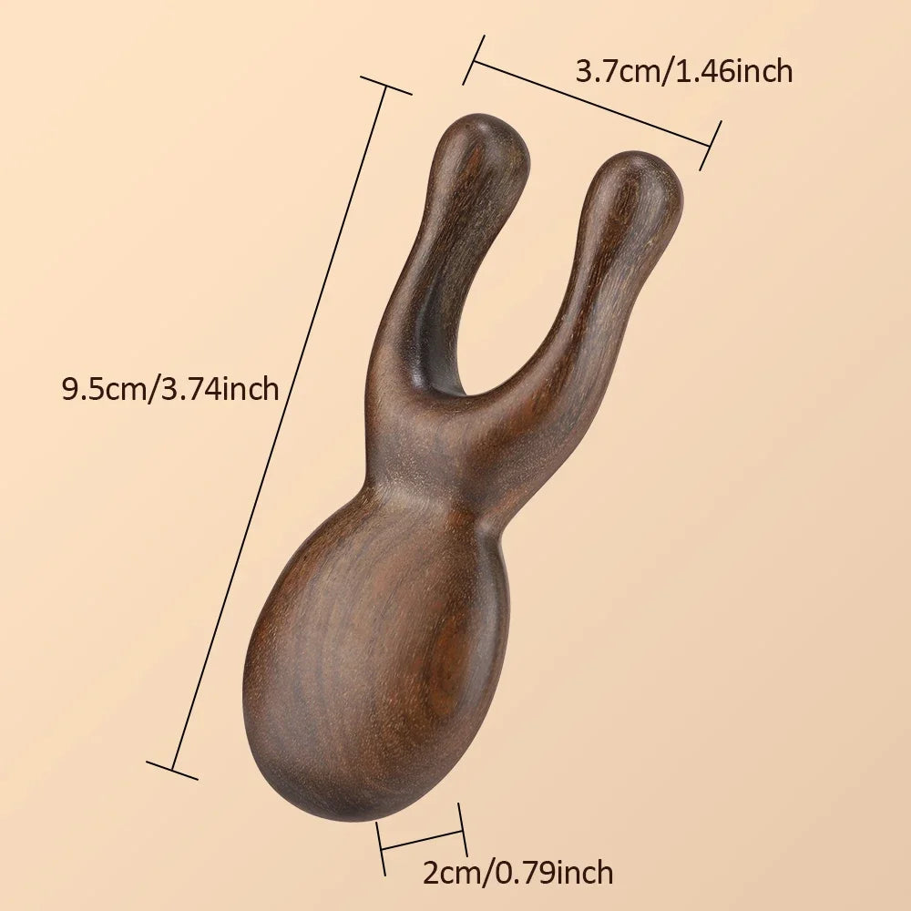 Wooden Gua Sha facial tool by Hot Trend Vault, made of sandalwood, used for face and neck massage to promote blood circulation.