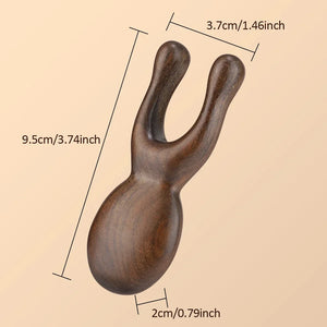 Wooden Gua Sha facial tool by Hot Trend Vault, made of sandalwood, used for face and neck massage to promote blood circulation.