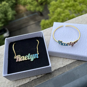Colorful stainless steel gold nameplate necklace and bangles set for kids featuring custom names and vibrant accents.