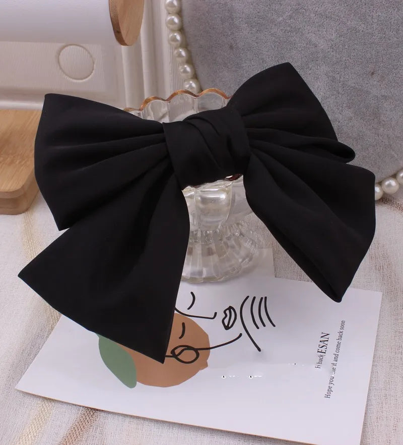 Elegant oversized satin bow barrette hair clip by Hot Trend Vault featuring a stylish knot design for women's hair accessories.