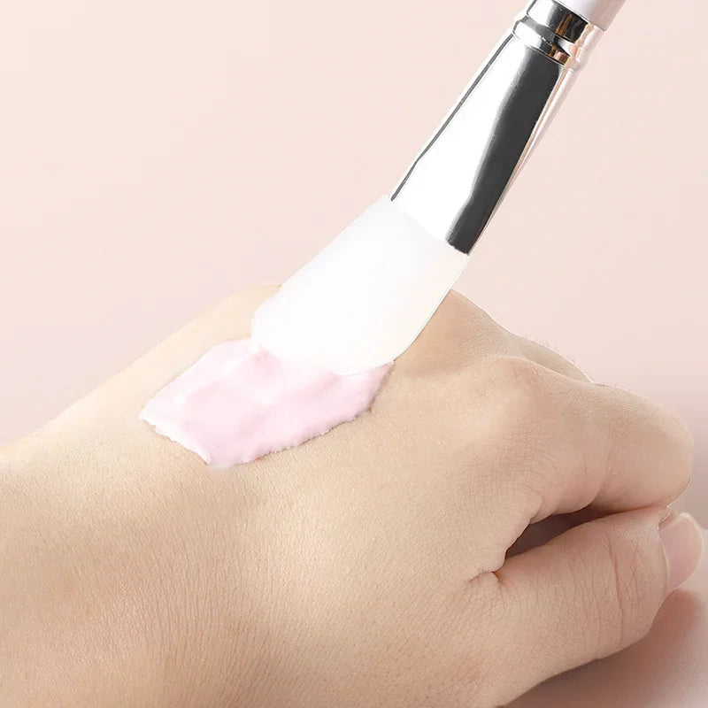 Soft fan-shaped facial mask brush by Hot Trend Vault, portable skin care tool for easy and precise mask application for women.