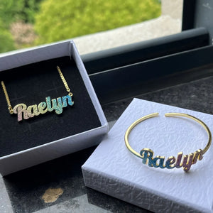Colorful stainless steel gold nameplate bangles featuring custom kid's name necklace set with vibrant, glossy finishes and playful design.