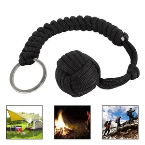 Outdoor self-defense umbrella rope kit with monkey fist steel ball and paracord key chain, designed for outdoor enthusiasts.