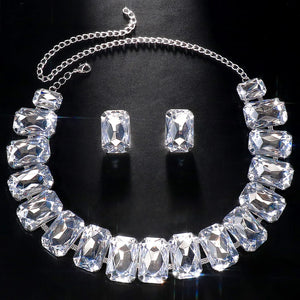 Luxury bridal jewelry set featuring geometric crystal necklace and earrings by Hot Trend Vault, sparkling stone fans design for brides.