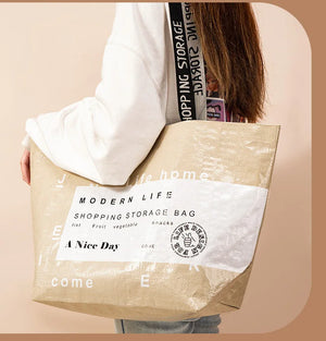 Foldable reusable waterproof shopping tote by Hot Trend Vault, eco-friendly design with sturdy handles for eco shoppers.