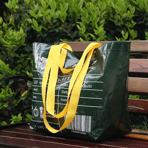 Foldable reusable waterproof shopping tote by Hot Trend Vault, eco-friendly tote bag with handles and compact design for shopping.