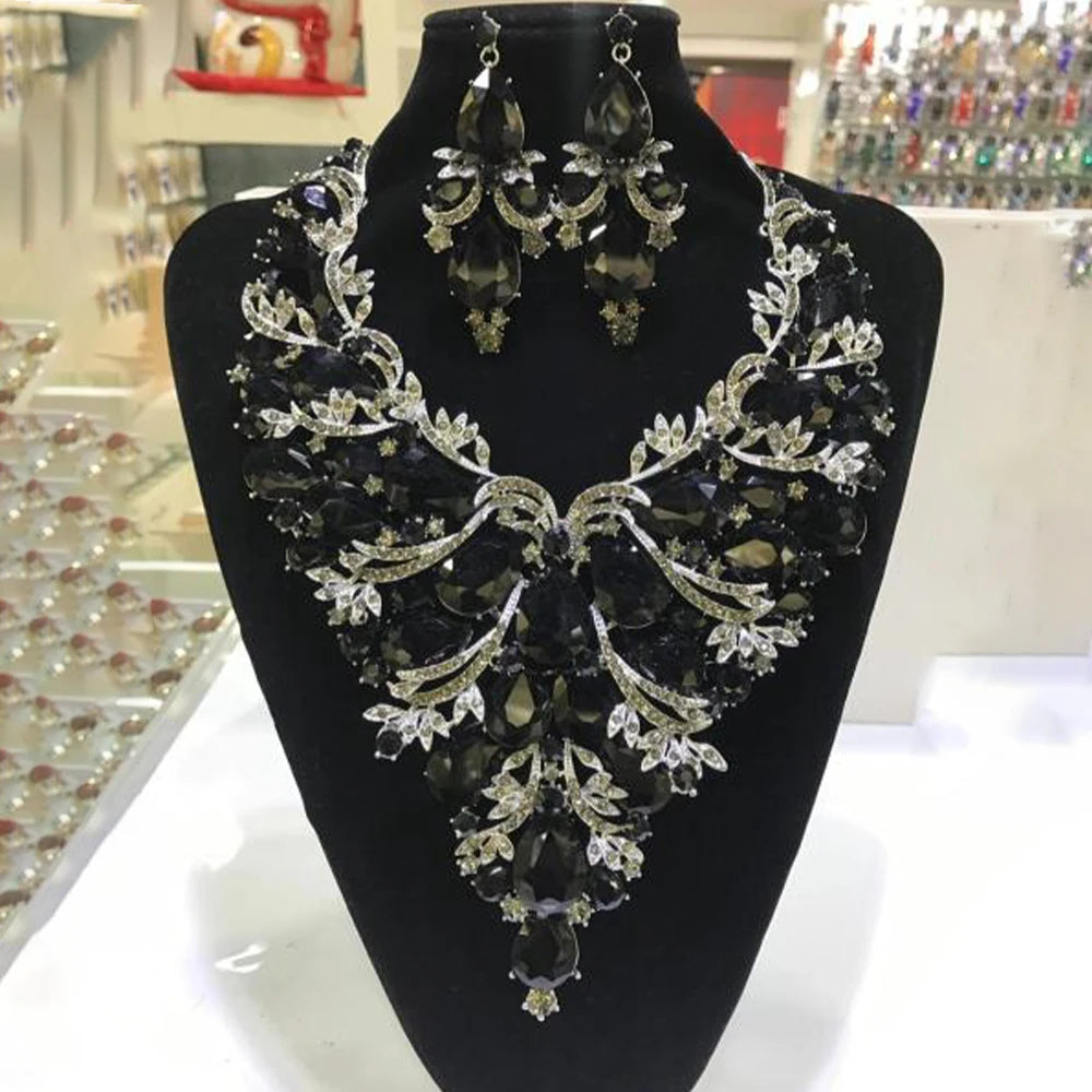 StoneFans rhinestone drop necklace and earrings set for women featuring glamorous exaggerated drag queen style, shiny rhinestones and bold design.