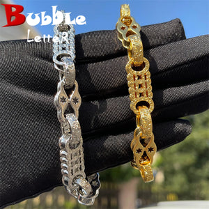 Gold plated bubble letter bracelet for men with iced out jewelry design, featuring bold, shiny lettering and stylish chain links.