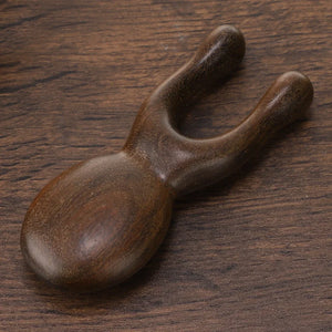 Hot Trend Vault wooden Gua Sha facial tool made of sandalwood for face and neck, promoting blood circulation and relaxation.