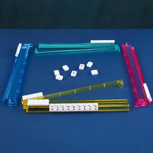 Set of four multicolor acrylic Mahjong tile pushers for family board game storage and organization.