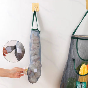Reusable mesh storage bags hanging in a kitchen, ideal for organizing vegetables and produce by Hot Trend Vault.