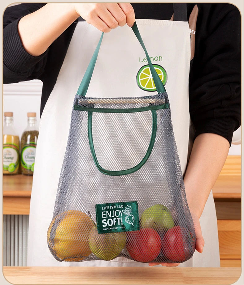 Reusable mesh storage bags hanging in a kitchen for vegetables, by Hot Trend Vault, ideal for organizing produce at home.