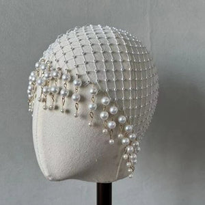 Handmade bridal pearl tassel hair accessory with geometric mesh design for women, featuring stone fans and elegant craftsmanship.