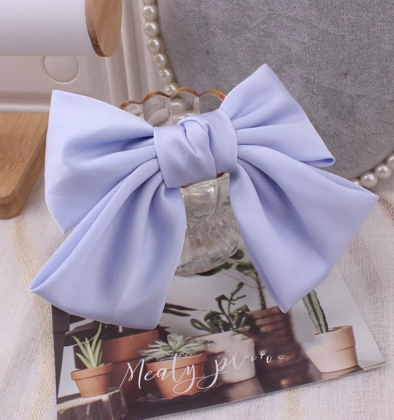 Elegant oversized satin bow knot hair clip for women, stylish barrette accessory from Hot Trend Vault.