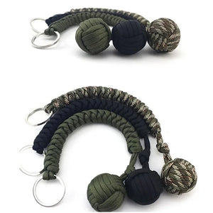 Outdoor self-defense umbrella rope kit with monkey fist steel ball, paracord key chain, suitable for outdoor enthusiasts.