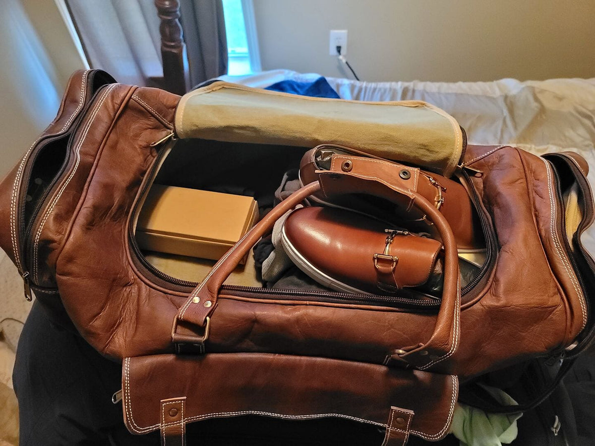 Hot Trend Vault goat leather weekender duffel bag with four exterior pockets, stylish and spacious for travel or weekend trips.