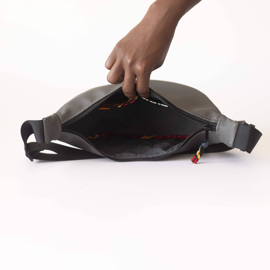 Gray vegan leather round mini crossbody shoulder bag with Kenyan fabric lining by Ecodunia.
