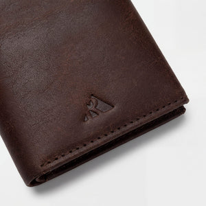 Full-grain vegetable tanned leather wallet with RFID blocking and popup card feature by Hot Trend Vault.