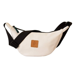 White round mini vegan leather shoulder bag with Kenyan fabric lining, stylish Ecodunia crossbody bag for casual or chic looks.