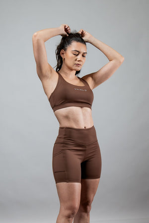 Women’s SOHO Cross Back Sports Bra by Hot Trend Vault in City Mocha, breathable fabric, offers supportive fit for active wear.