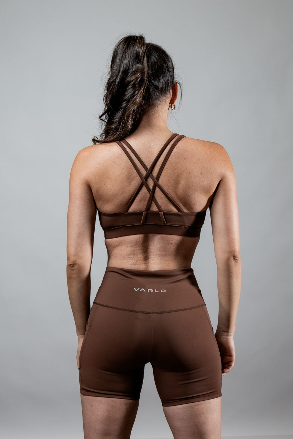 Women's Soho cross-back sports bra by Hot Trend Vault in City Mocha, featuring breathable fabric and supportive design for active wear.
