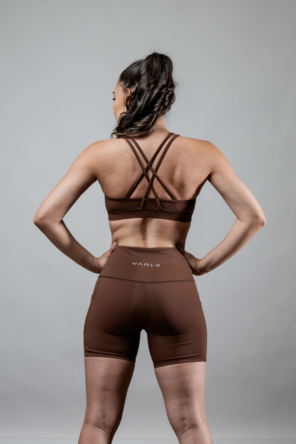 Women’s SOHO Cross Back Sports Bra by Hot Trend Vault in City Mocha, breathable fabric, offering support and comfort during workouts.