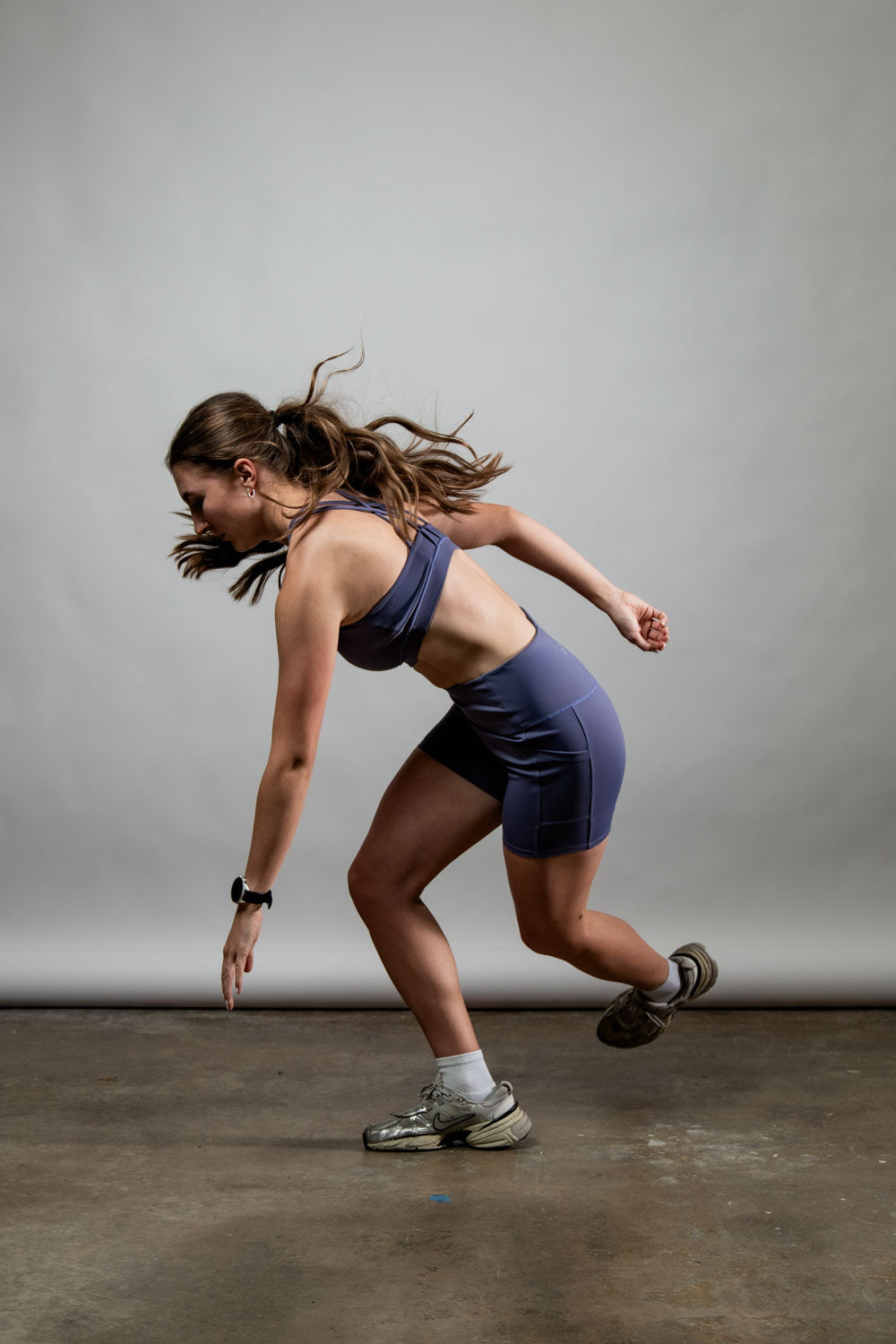 Women wearing Hot Trend Vault SOHO Cross Back Sports Bra in Lilac Mist, supportive and breathable activewear for exercise.
