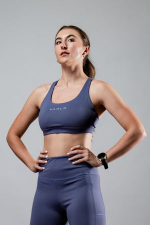 Women wearing Hot Trend Vault SOHO cross back sports bra in Lilac Mist, supportive and breathable activewear for active use.