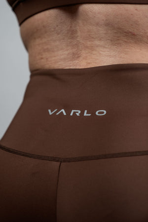 Women’s SOHO 5-inch inseam fitness shorts in City Mocha by Hot Trend Vault, shown on a woman’s legs with athletic styling.