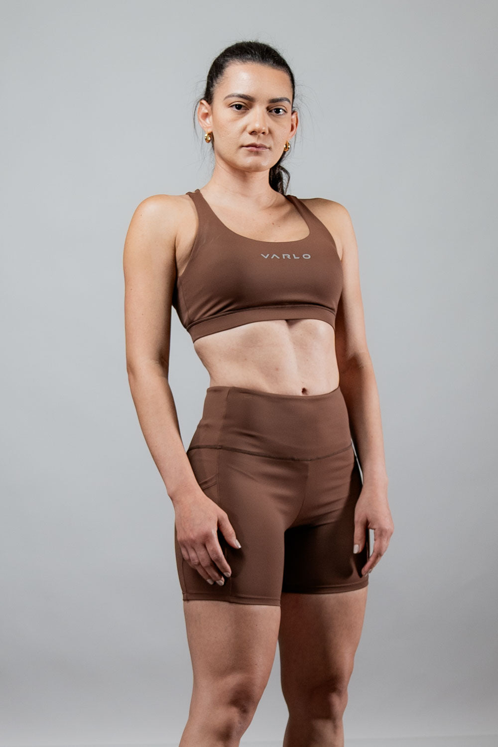 Women’s SOHO 5-inch inseam fitness shorts by Hot Trend Vault in city mocha, shown on a woman, highlighting comfortable athletic wear.