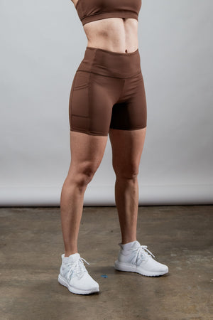 Women’s SOHO 5-inch inseam fitness shorts by Hot Trend Vault in city mocha, shown on a woman, ideal for active wear.