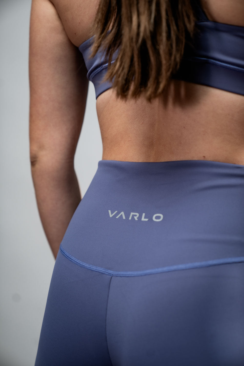 Women wearing Hot Trend Vault SOHO women's five-inch inseam fitness shorts in Lilac Mist, showing the comfortable fit and vibrant color.