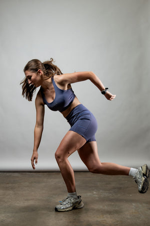 Women wearing Lilac Mist SOHO women's five-inch inseam fitness shorts by Hot Trend Vault, showing the casual fit and comfortable fabric.