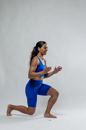 Women wearing Hot Trend Vault Soho Fitness Shorts in Neo Blue, 8-inch length, designed for all-day comfort and active wear.