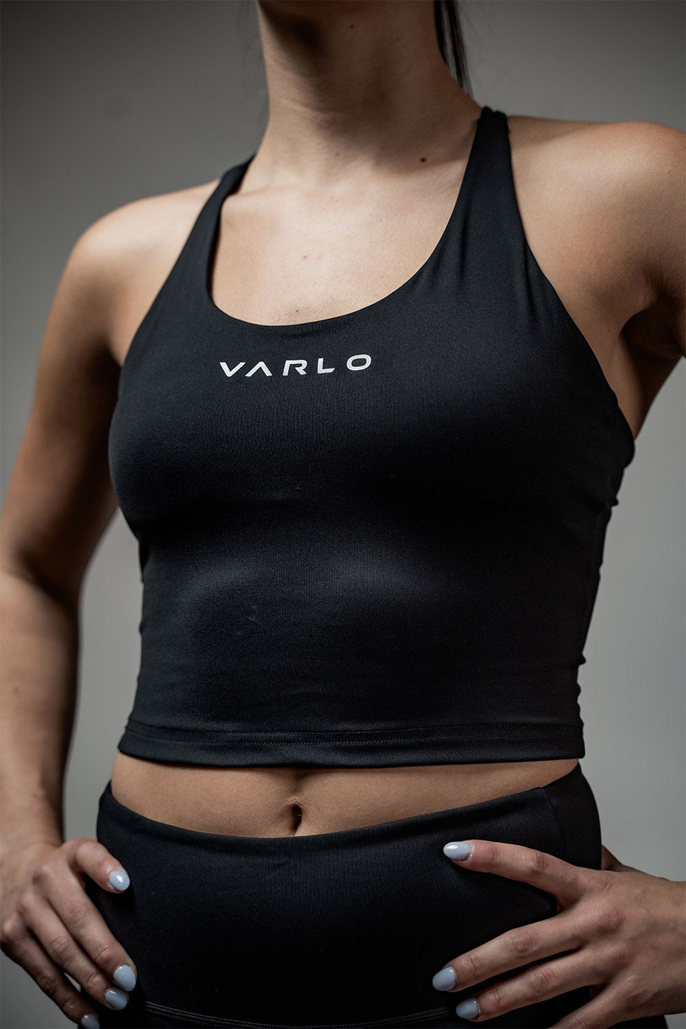 Black SOHO women's cross back crop tank top by Hot Trend Vault, featuring a sleek design and supportive fit.