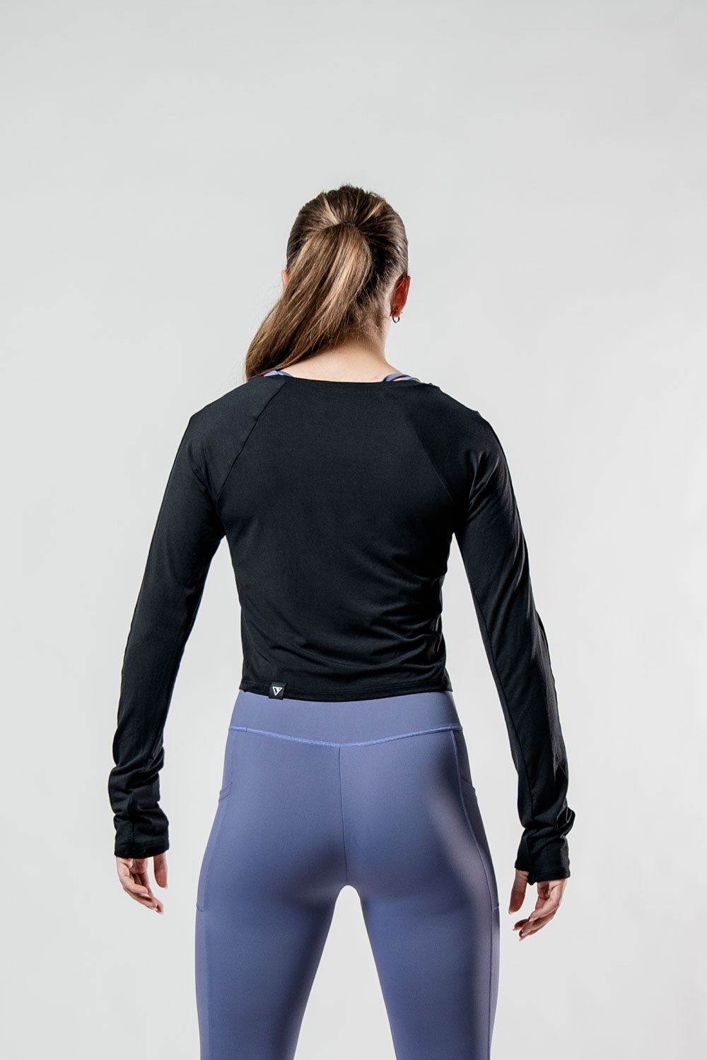 Black Women's Terra Recovery Arc Long Sleeve Crop Top T-shirt by Hot Trend Vault, featuring a fitted design and long sleeves.