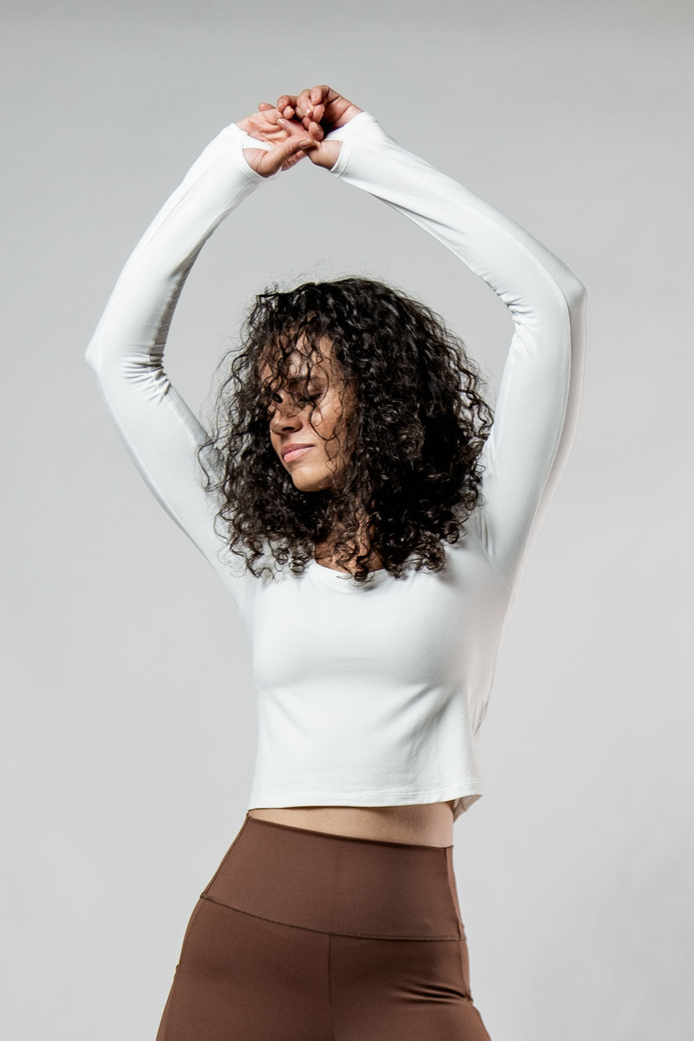 Women's Terra Recovery Arc Long Sleeve Crop T-Shirt in soft white by Hot Trend Vault, featuring a fitted style and subtle design details.