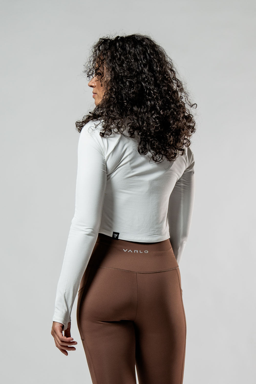 Women's white long sleeve crop t-shirt from Hot Trend Vault with soft fabric and recovery arc design.